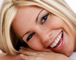 photo of woman smiling after treatment with adult braces