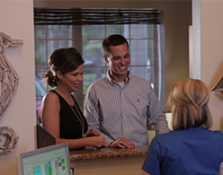 photo of patients getting information at the front desk
